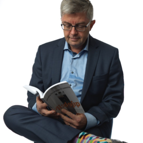 Coach Colin reading from his book about leading a team to success